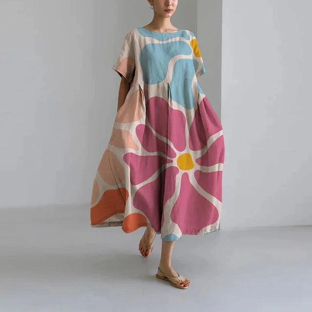 https://cdn.shopify.com/s/files/1/0741/0774/8619/files/robe-longue-verte-fleurs-multicolores.webp?v=1726495667